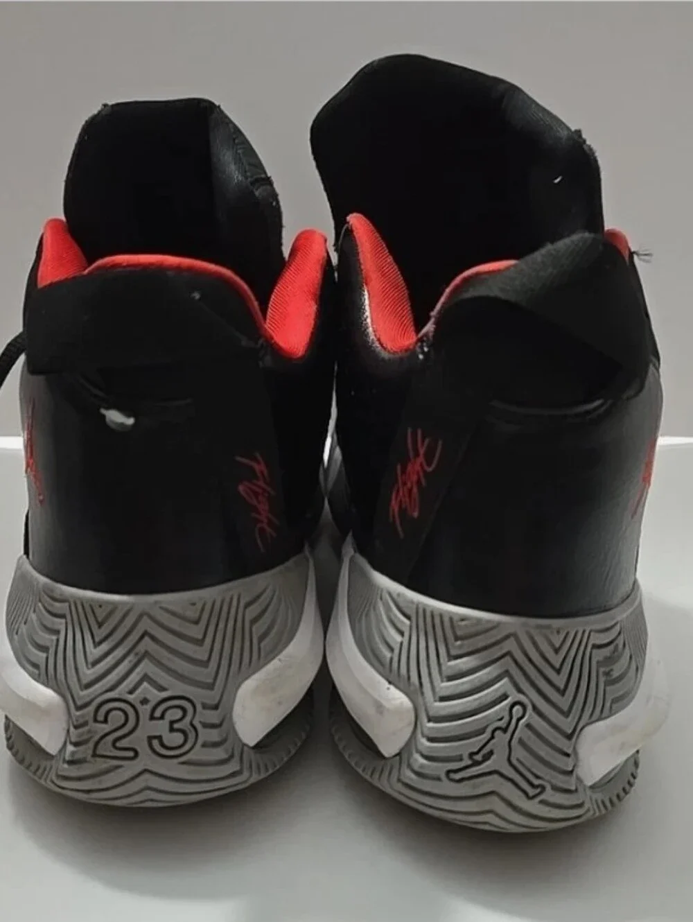 -- Air Jordan Men’s Black and Red High-Top Sneakers Size 11.5